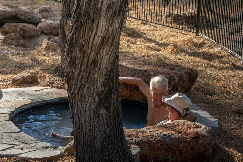 A couple enjoy one of Talaroo's private hot springs.